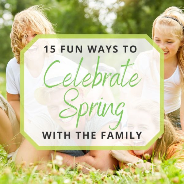 family playing outside in the grass and flowers